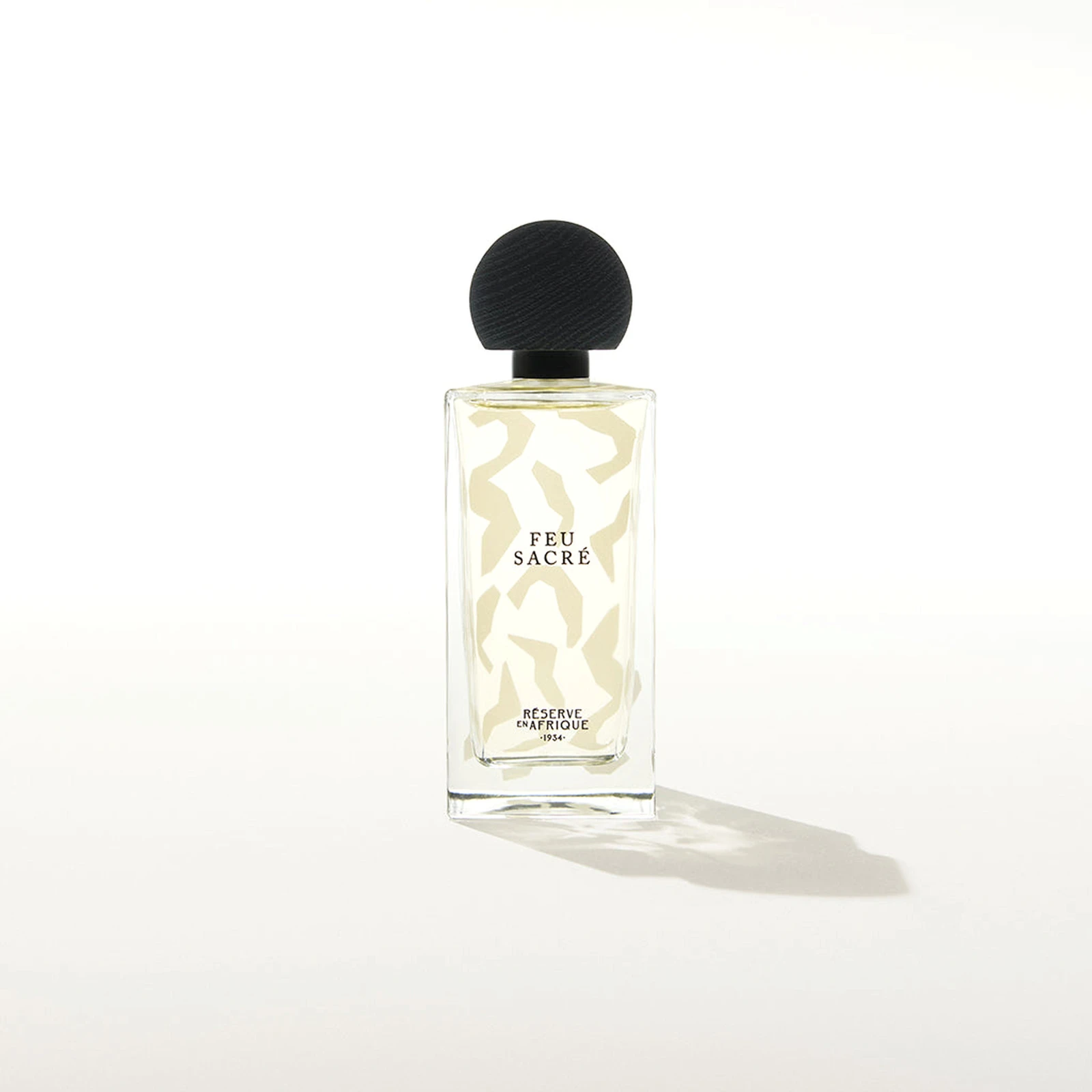 Feu Sacré by Réserve en Afrique perfume bottle – smoky amber woody fragrance with incense, myrrh, and sandalwood evoking sacred warmth and quiet power.