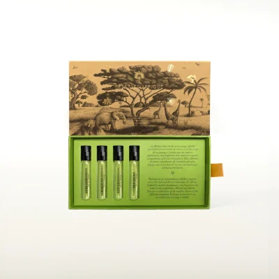 Réserve en Afrique Discovery Set – luxury perfume sample collection featuring Vanille Mafonja, Rouge Karkadé, Feu Sacré, and Bois d’Olivier in elegant travel vials.